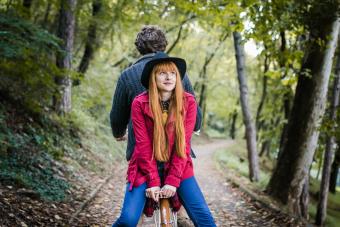 Couple enjoying ride on bicycle