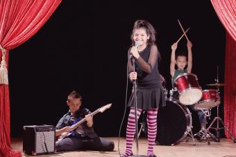 Siblings performing on stage