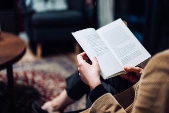 Woman relaxing and reading book