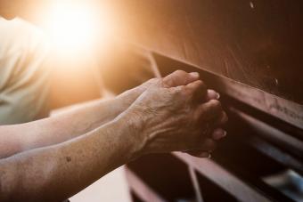 Senior praying in church