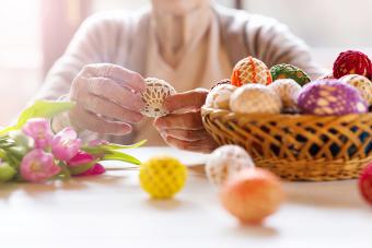 Senior with easter basket and eggs