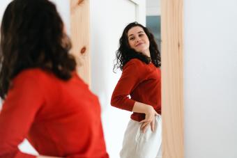 Young beautiful self confident woman in red sweater