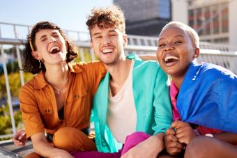 Group of friends laughing outdoors