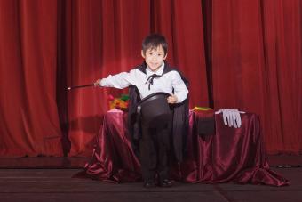 Boy doing magic tricks