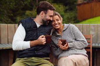 couple smiling and drinking tea together