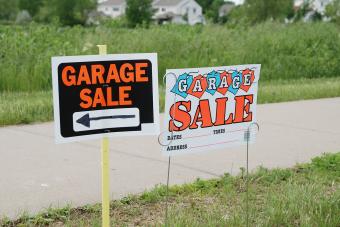 Garage signs in front of a suburban housing development