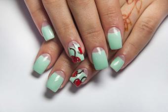 https://cf.ltkcdn.net/www/images/slide/358494-850x565--mint-manicure-with-cherries-on-the-ring-finger-502447957.jpg